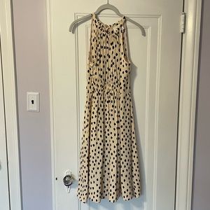 Leopard dotted dress with keyhole back & bow, gathered waist. 100% viscose.